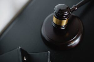 wooden gavel on table in courtroom