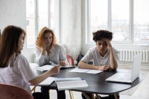 serious multiethnic coworkers working on business project in office